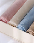 Babypledd i kasjmir i beige, hvit, lys rosa og lys blå